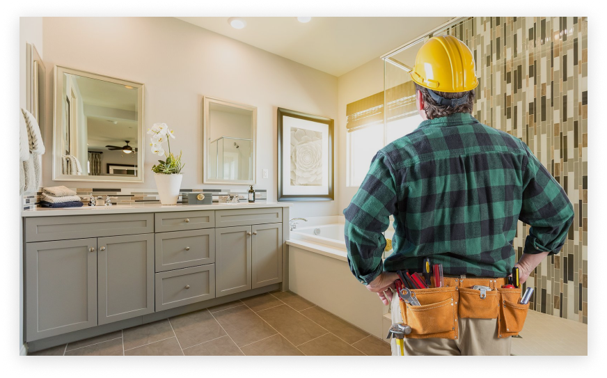 Construction worker surveying bathroom